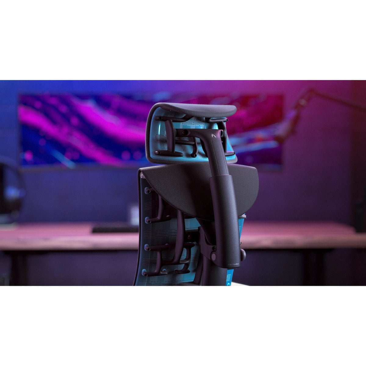 Atlas headrest fitted to the back of an ergonomic office chair at a desk