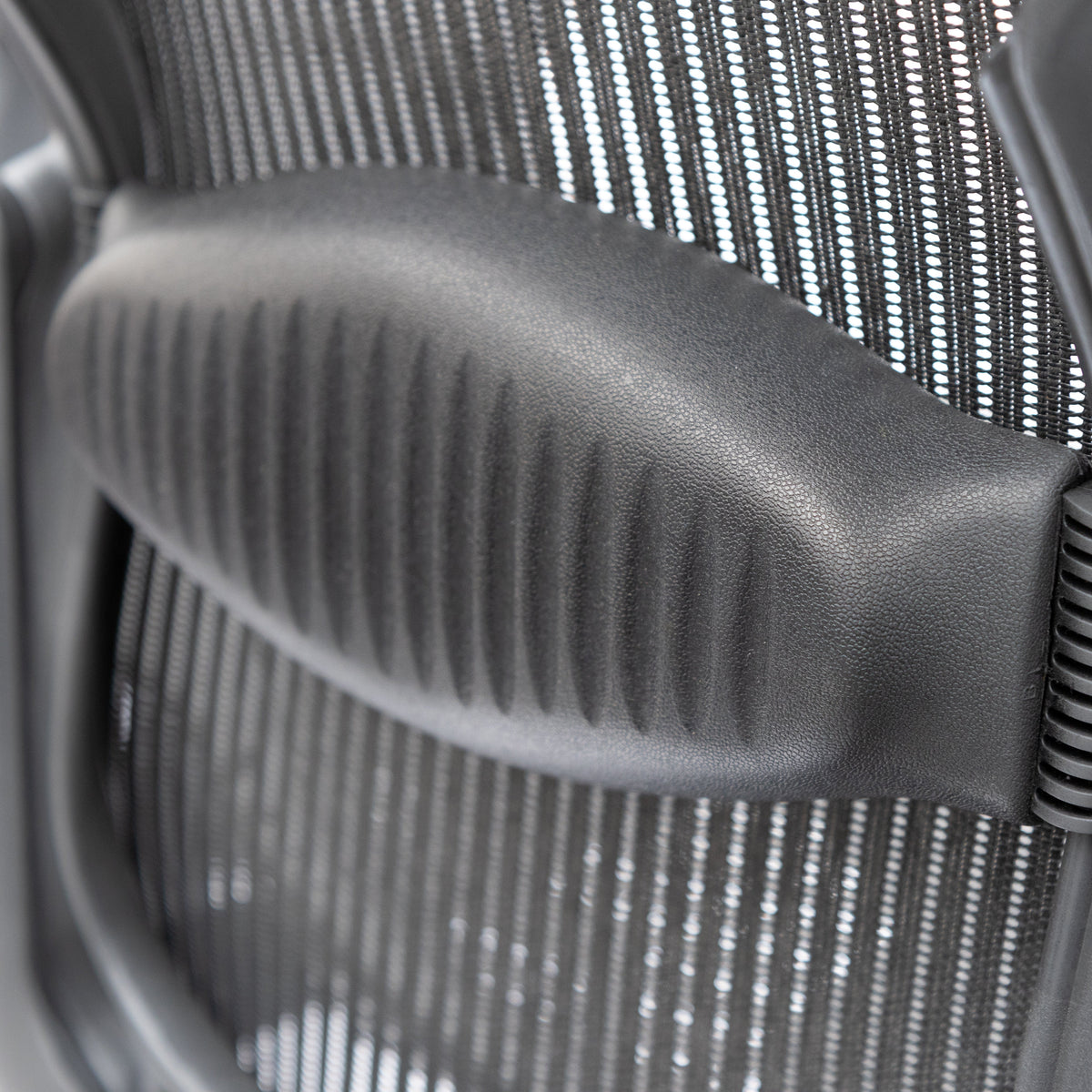 Close-up of the lumbar support pad on a Herman Miller Aeron chair