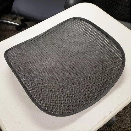 Herman Miller Aeron seat pan with its mesh, removed from the chair