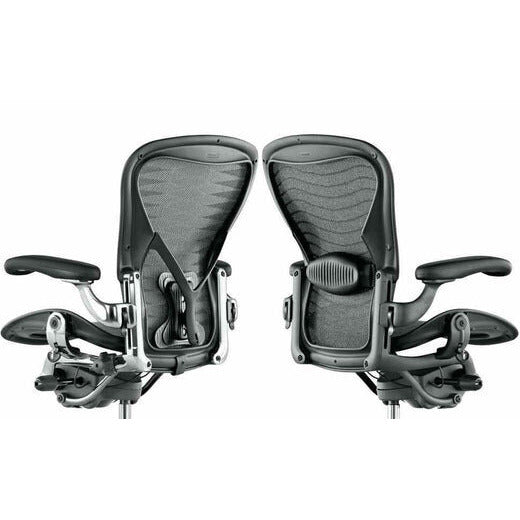 Two Herman Miller Aeron Classic chairs from behind, comparing the lumbar pad and PostureFit back supports